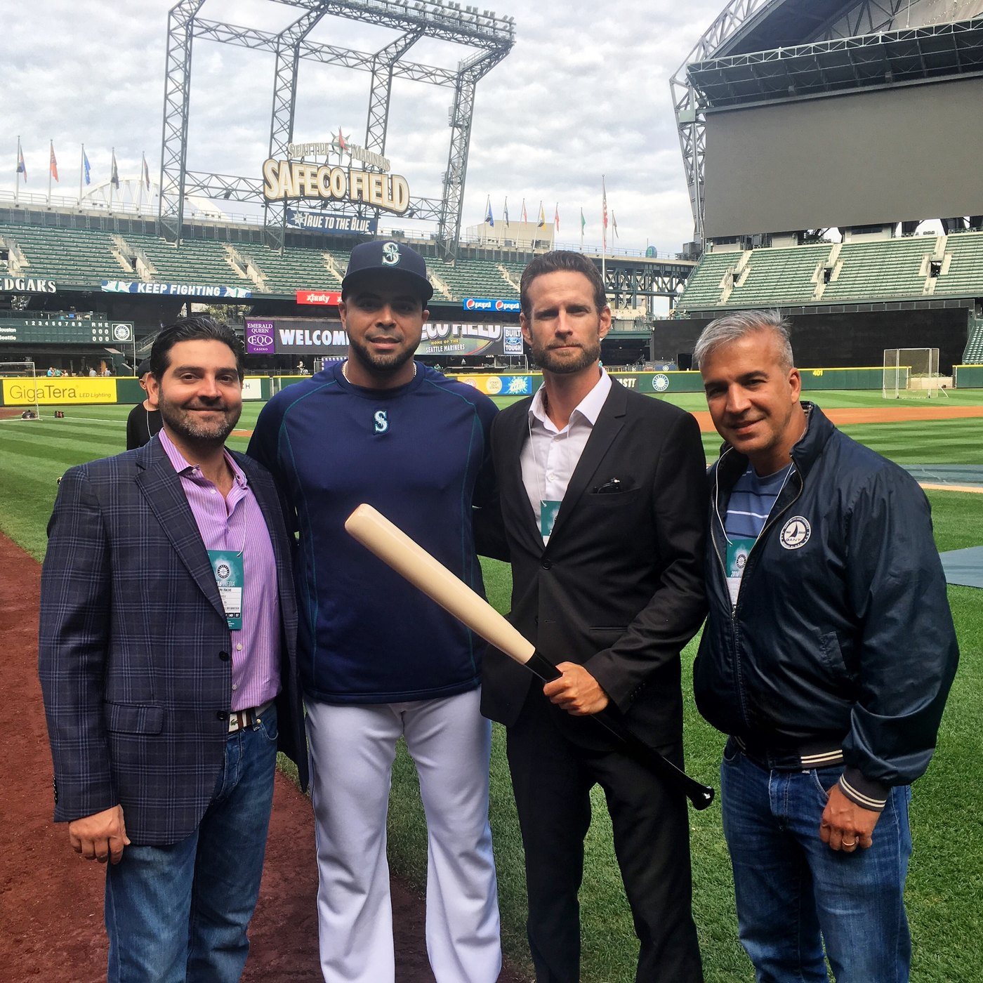 Bryan Ingram with Nelson Cruz and Players for the Planet colleagues on the field at Safeco Field, Seattle